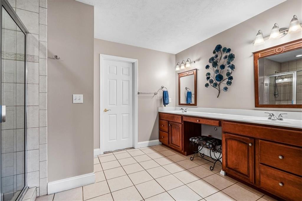 185 Pinkerton Road Wexford, PA 15090 - Photo 20 of 40 a spacious bathroom with a double vanity sink and a mirror