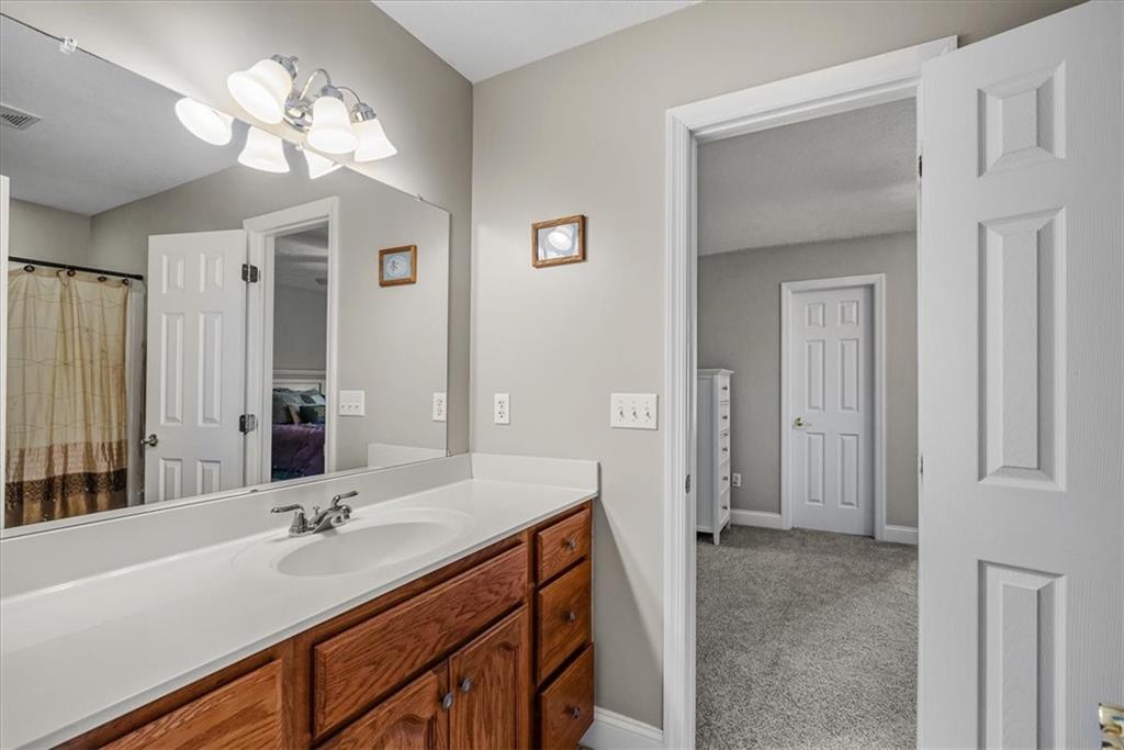 185 Pinkerton Road Wexford, PA 15090 - Photo 22 of 40 a bathroom with a double vanity sink and a mirror