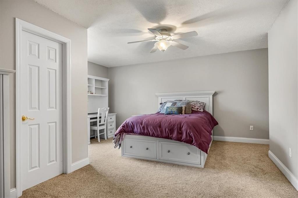 185 Pinkerton Road Wexford, PA 15090 - Photo 23 of 40 a spacious bedroom with a bed and a chandelier