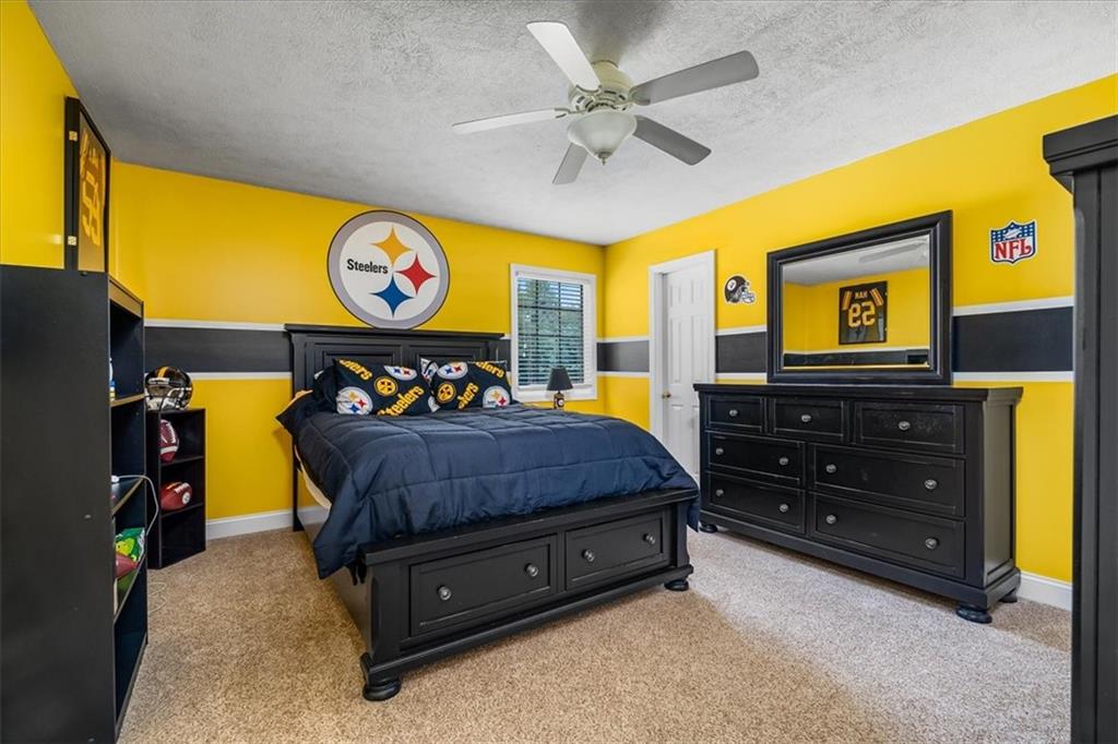 185 Pinkerton Road Wexford, PA 15090 - Photo 25 of 40 a bedroom with a bed and dresser