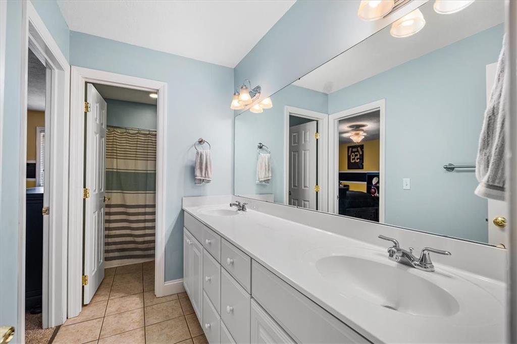 185 Pinkerton Road Wexford, PA 15090 - Photo 26 of 40 a spacious bathroom with a double vanity sink and a mirror
