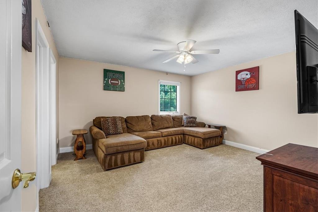 185 Pinkerton Road Wexford, PA 15090 - Photo 27 of 40 a living room with furniture and a ceiling fan