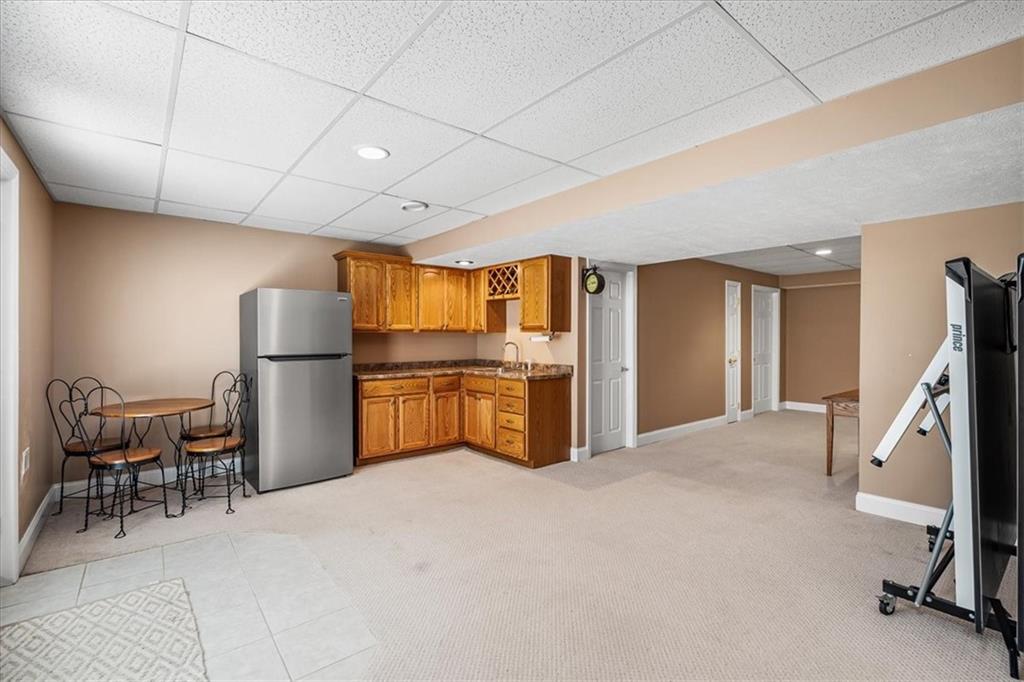 185 Pinkerton Road Wexford, PA 15090 - Photo 29 of 40 a view of a kitchen with furniture and a refrigerator
