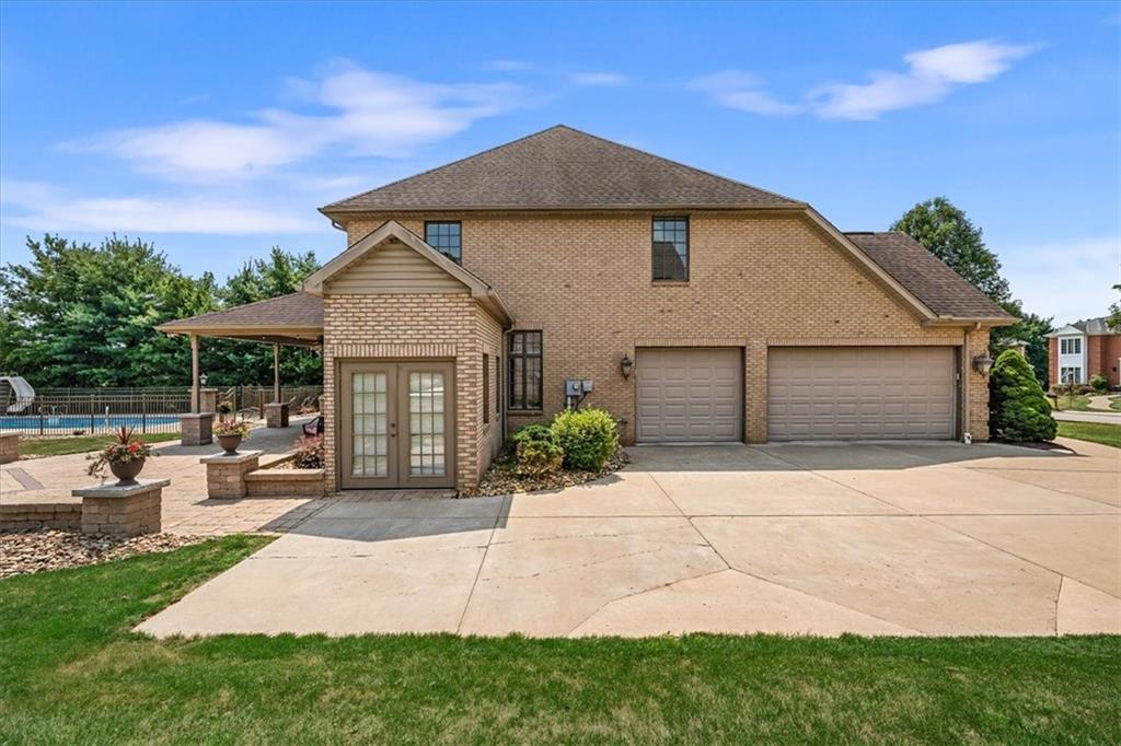 185 Pinkerton Road Wexford, PA 15090 - Photo 33 of 40 a front view of a house with a garden