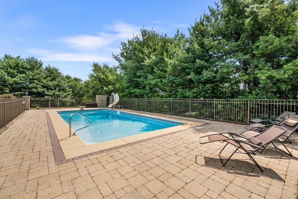 185 Pinkerton Road Wexford, PA 15090 - Photo 36 of 40 a view of a swimming pool with a lounge chair