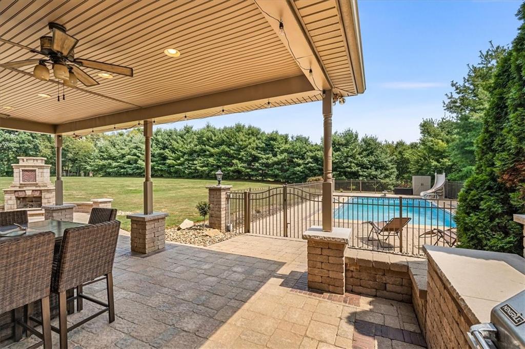 185 Pinkerton Road Wexford, PA 15090 - Photo 38 of 40 a view of a patio with a table chairs and a backyard
