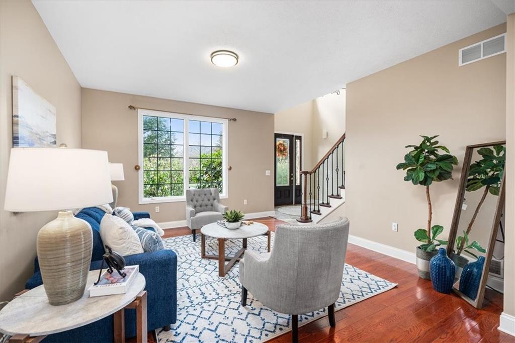 185 Pinkerton Road Wexford, PA 15090 - Photo 6 of 40 a living room with furniture potted plant and a window