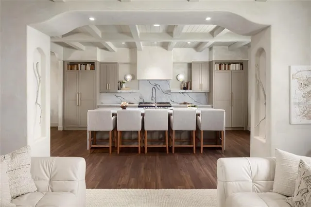 a living room with furniture dining table and wooden floor