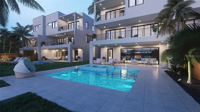 a swimming pool view with a outdoor seating