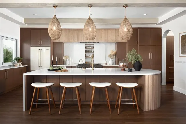 a kitchen with a table and chairs in it