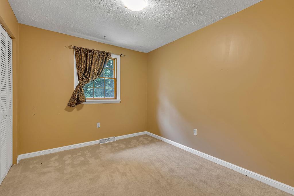 171 Dehaven Road Beaver Falls, PA 15010 - Photo 21 of 35 a view of an empty room with a window