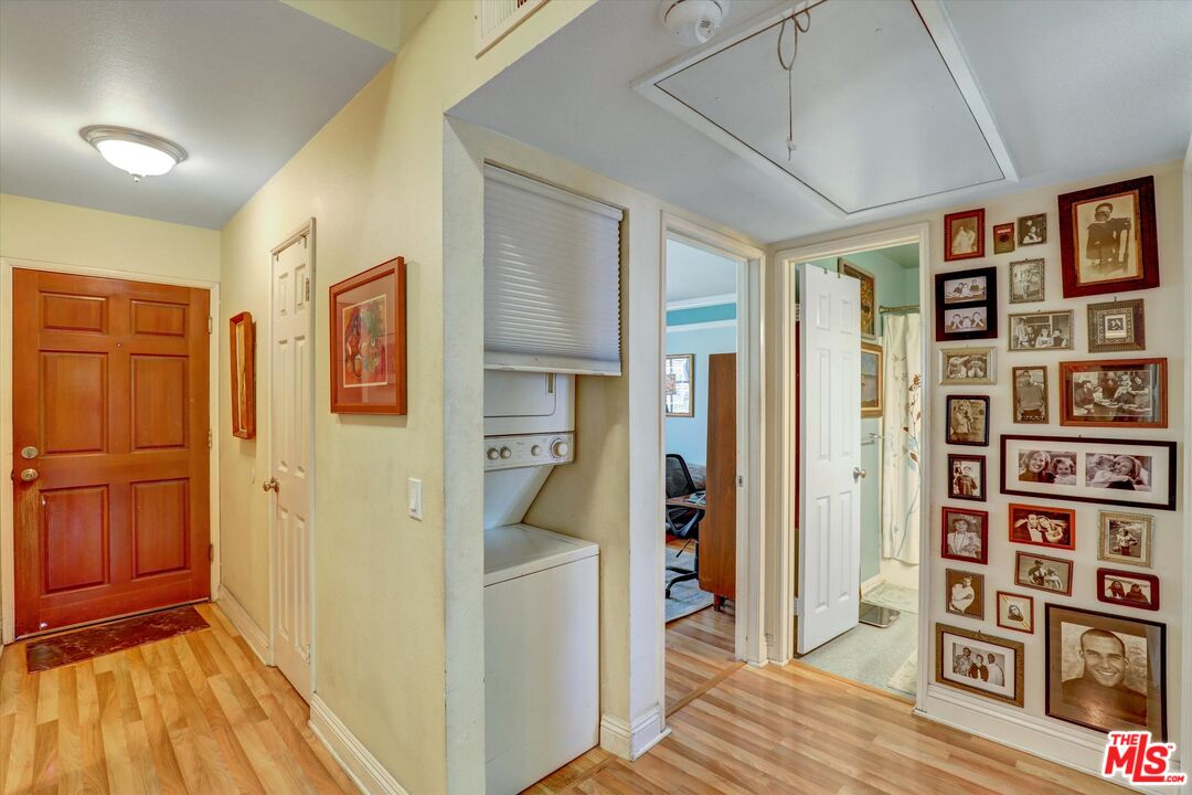 645 Chestnut Avenue, Unit 316 Long Beach, CA 90802 - Photo 11 of 24 a view of a bedroom with furniture and wooden floor