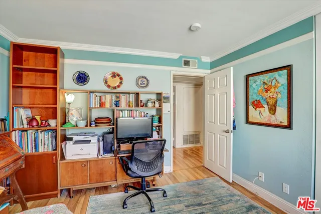 a workspace with furniture and wooden floor