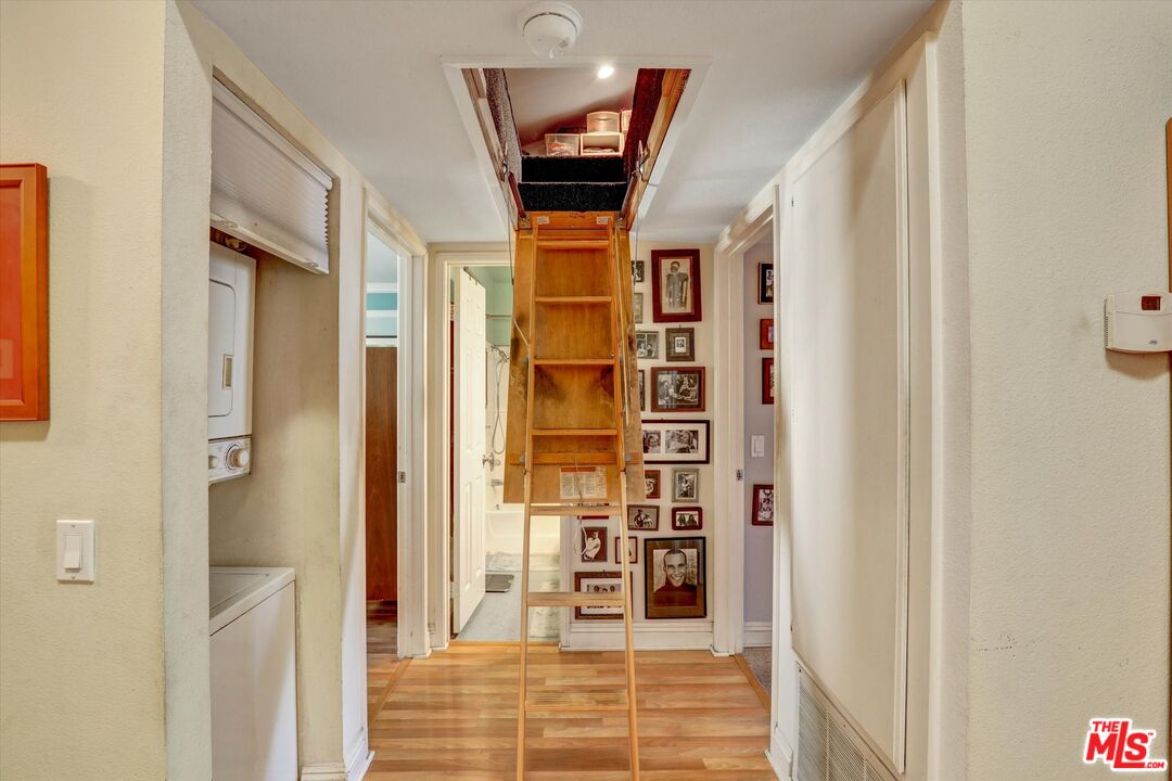645 Chestnut Avenue, Unit 316 Long Beach, CA 90802 - Photo 20 of 24 a view of a hallway with wooden floor and entryway