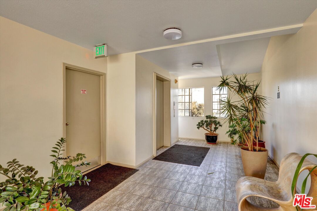 645 Chestnut Avenue, Unit 316 Long Beach, CA 90802 - Photo 21 of 24 a view of a porch with furniture and a potted plant