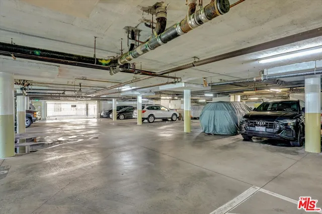 a view of parking garage with cars