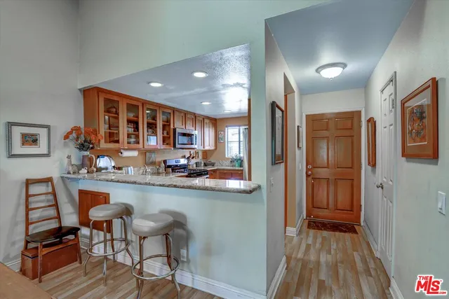 a kitchen with sink and refrigerator