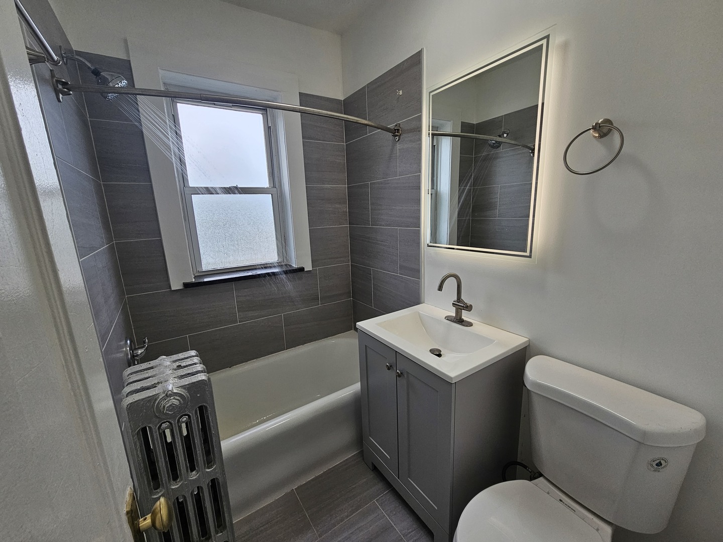 6551 North Francisco Avenue, Unit 3B Chicago, IL 60645 - Photo 12 of 15 a bathroom with a sink toilet and shower