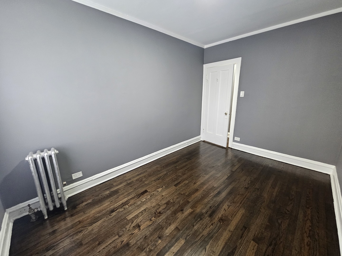 6551 North Francisco Avenue, Unit 3B Chicago, IL 60645 - Photo 14 of 15 a view of room with wooden floor and chair