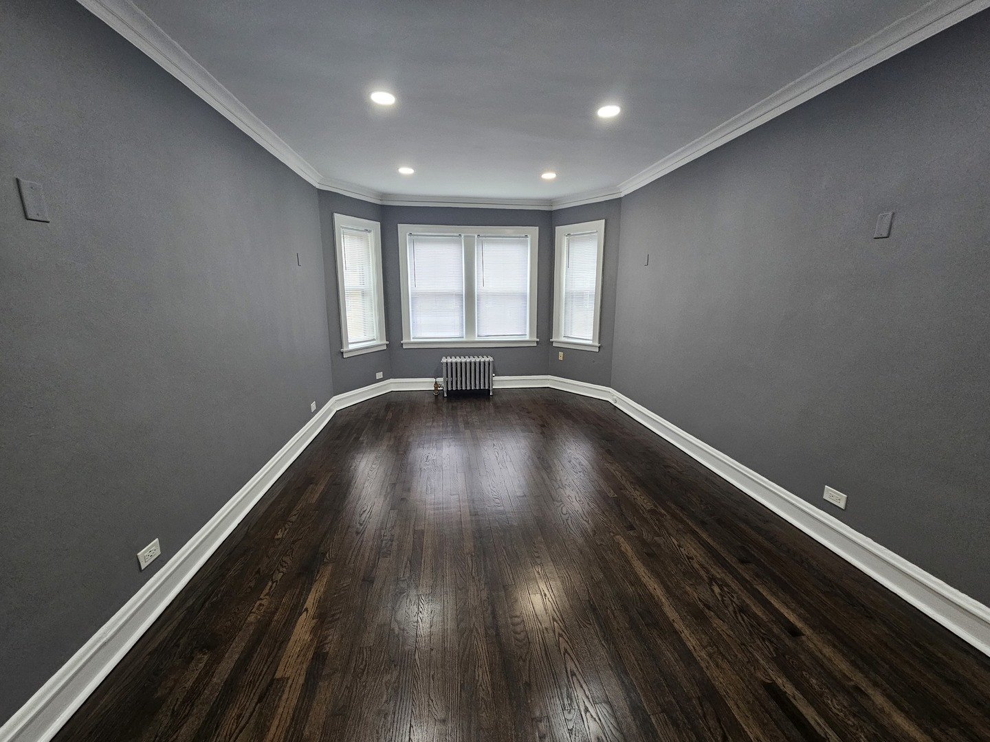 6551 North Francisco Avenue, Unit 3B Chicago, IL 60645 - Photo 2 of 15 a view of room with window and wooden floor