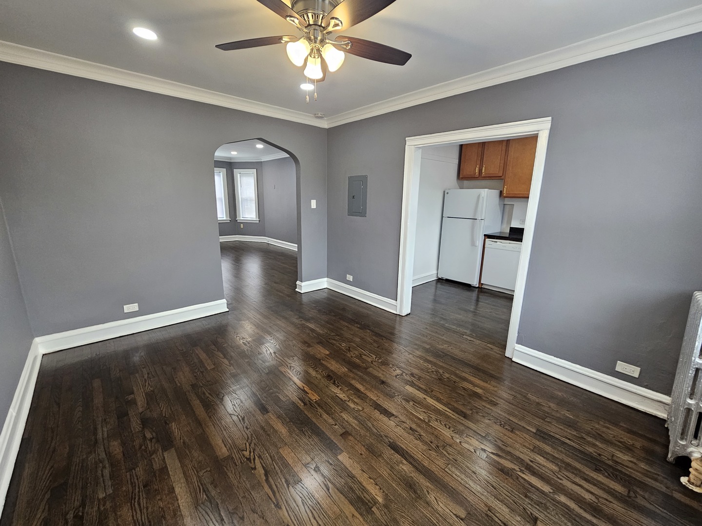 6551 North Francisco Avenue, Unit 3B Chicago, IL 60645 - Photo 7 of 15 wooden floor in an empty room with a window