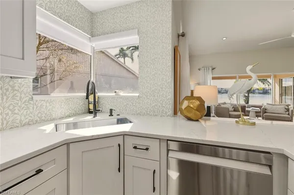 a kitchen with a sink and a cabinets