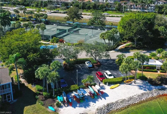 a view of a house with swimming pool and sitting area