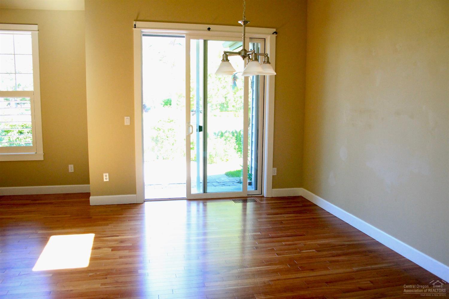 19459 Blue Lake Loop Bend, OR 97702 - Photo 6 of 19 a view of a hallway with wooden floor