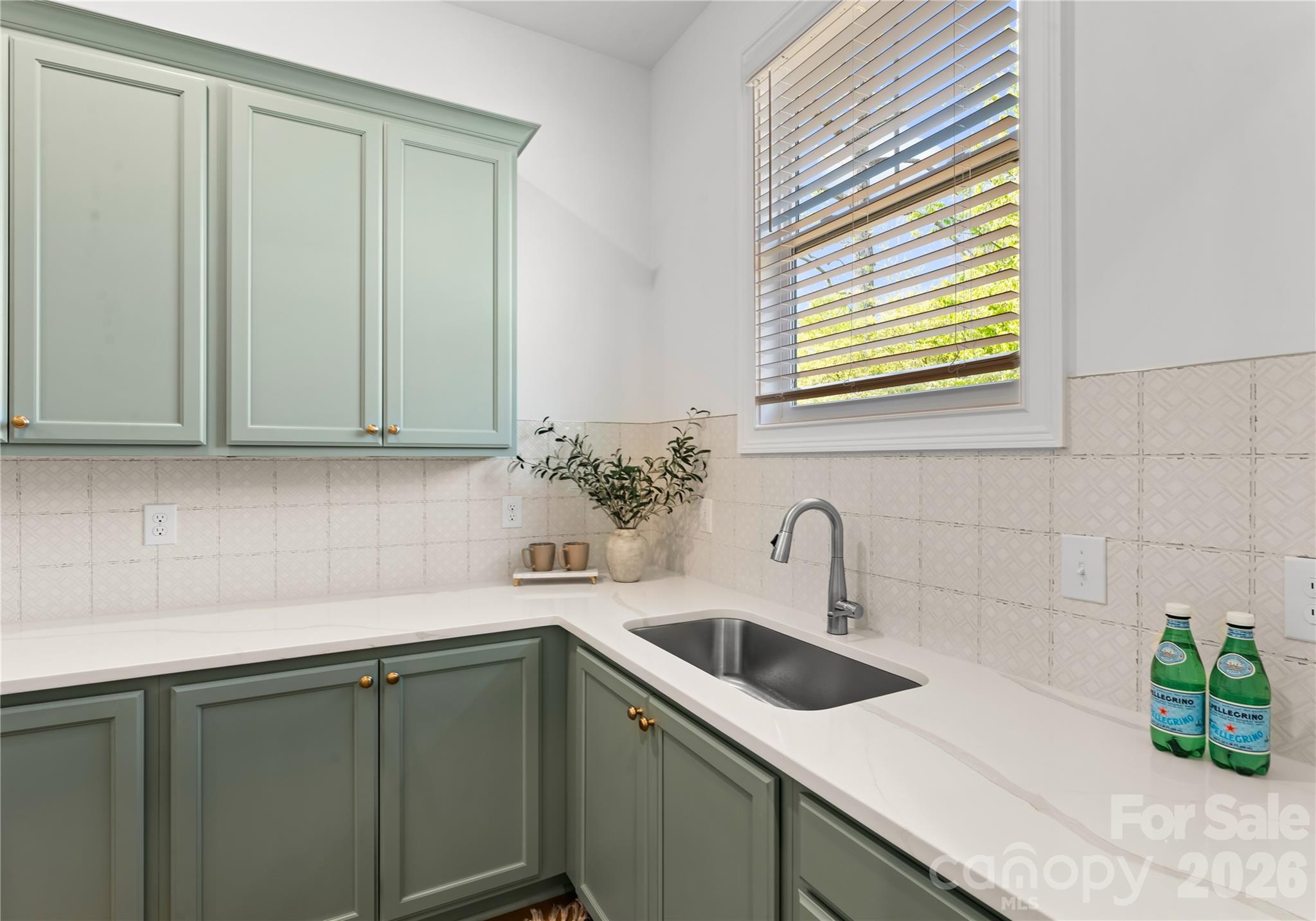121 Vella Drive Locust, NC 28097 - Photo 13 of 46 a kitchen with stainless steel appliances white cabinets and a sink