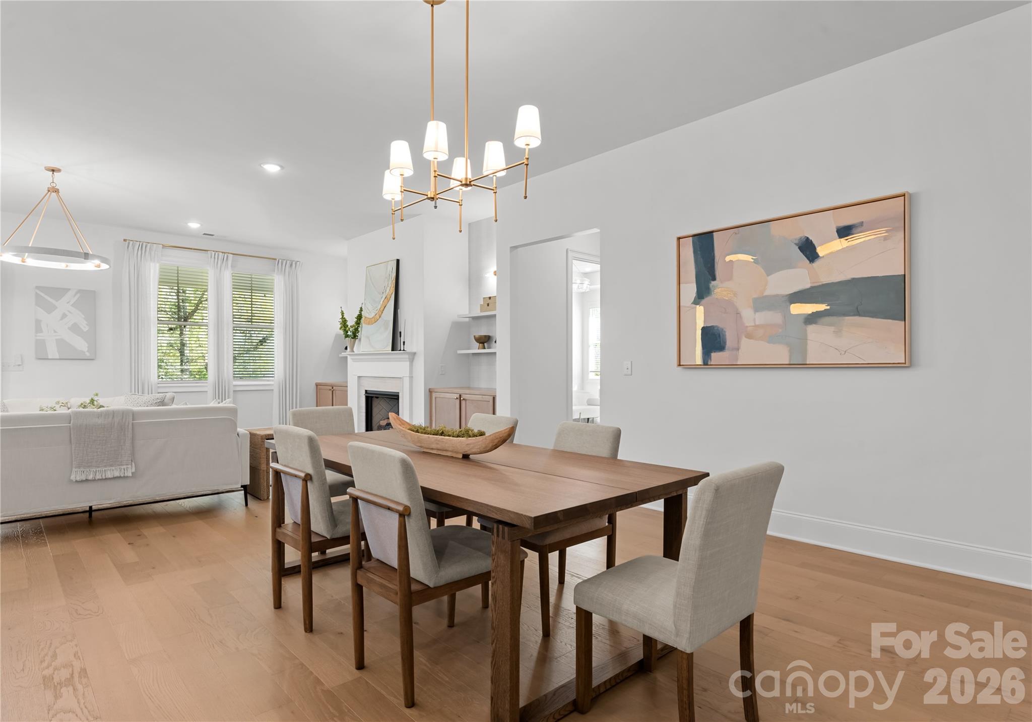 121 Vella Drive Locust, NC 28097 - Photo 15 of 46 a view of a dining room with furniture window and wooden floor