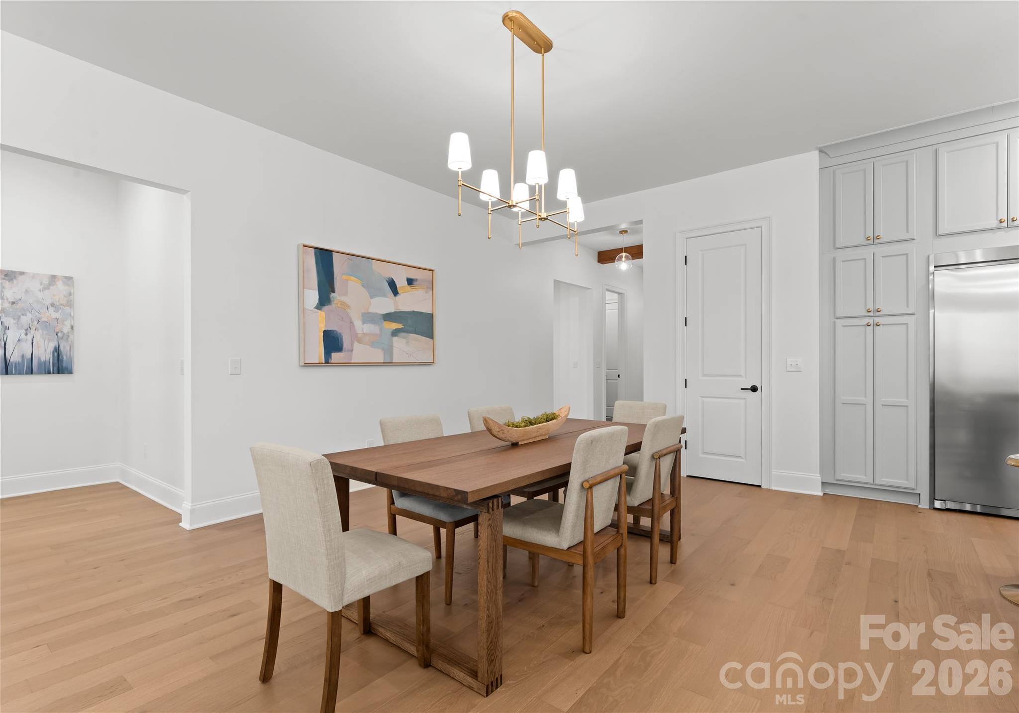 121 Vella Drive Locust, NC 28097 - Photo 17 of 46 a view of a dining room with furniture and wooden floor