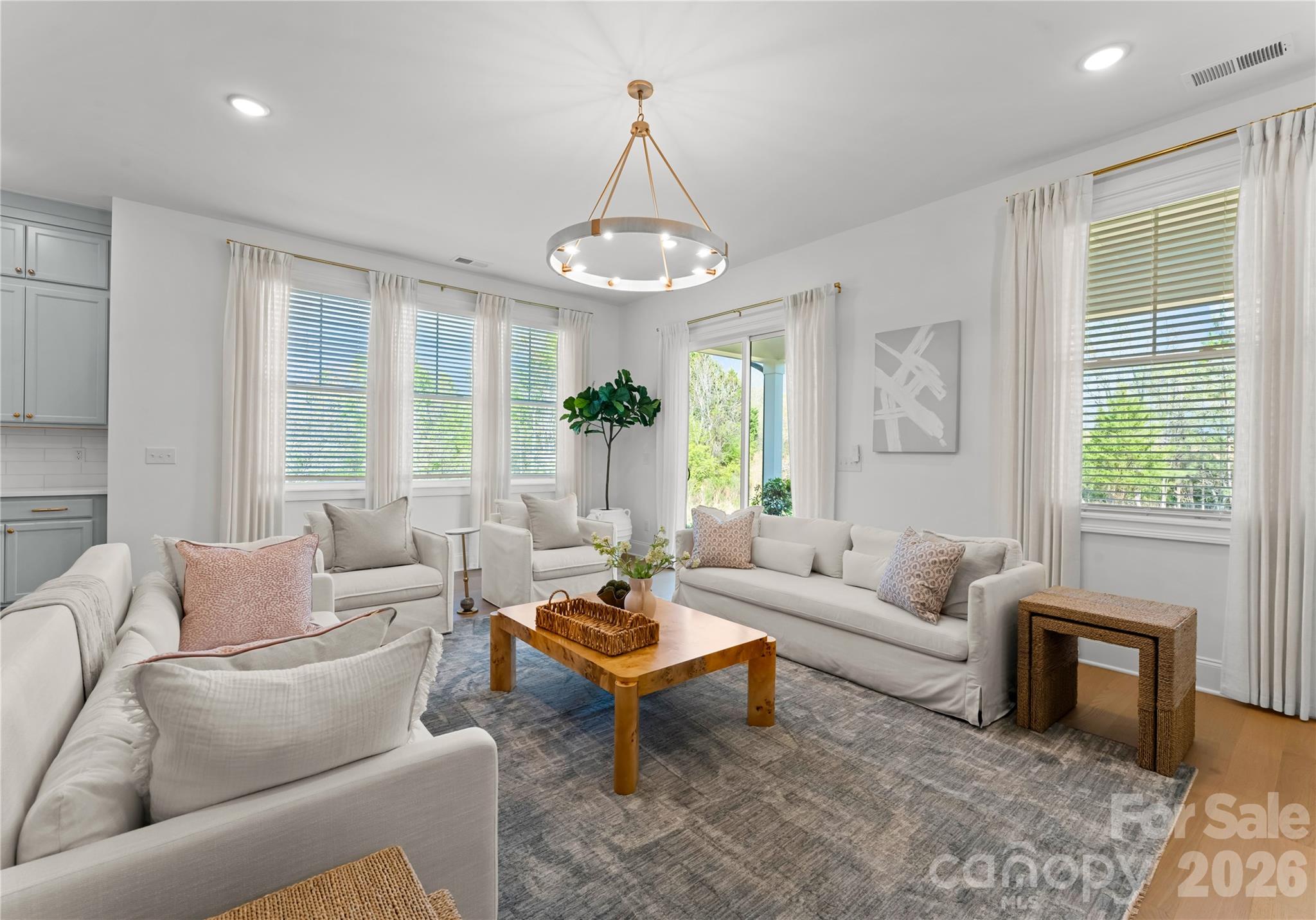 121 Vella Drive Locust, NC 28097 - Photo 21 of 46 a living room with furniture and a chandelier