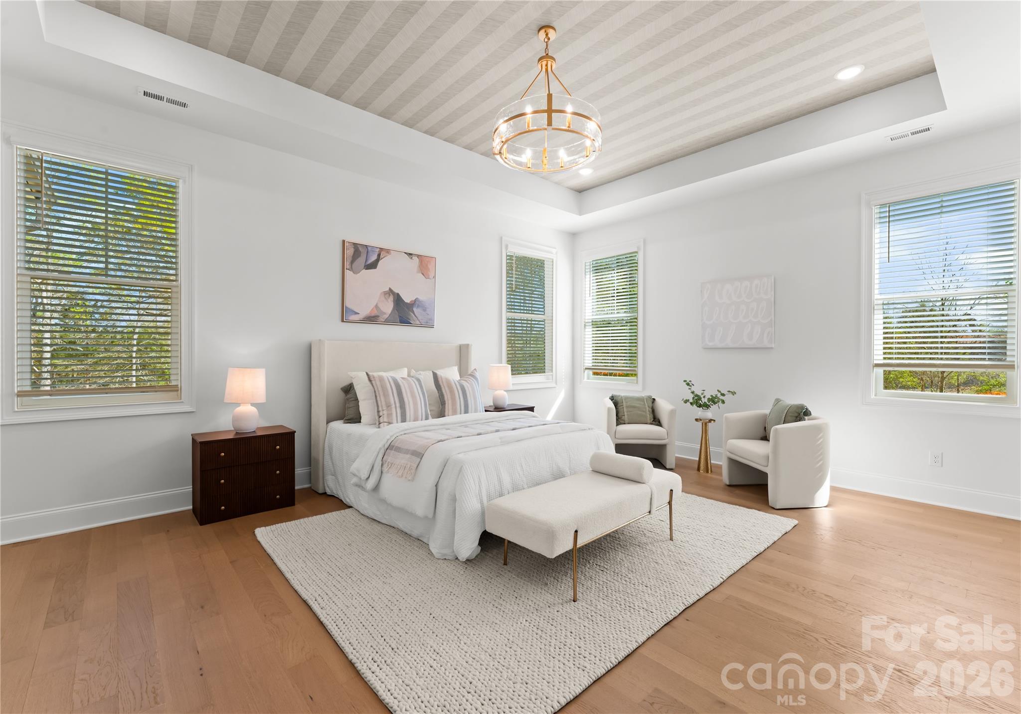 121 Vella Drive Locust, NC 28097 - Photo 24 of 46 a spacious bedroom with a bed couch and window