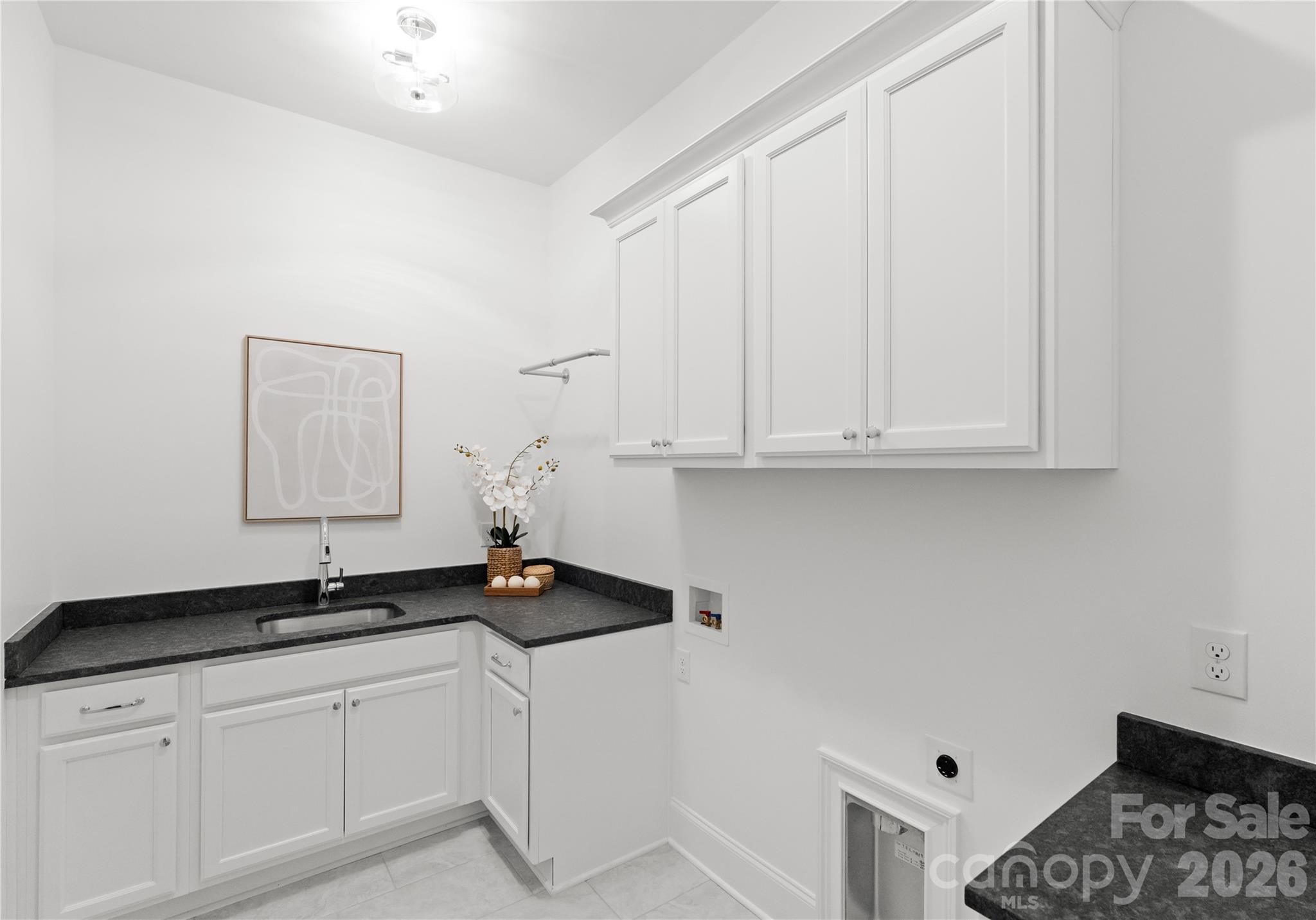 121 Vella Drive Locust, NC 28097 - Photo 42 of 46 a close view of a sink a mirror and cabinets