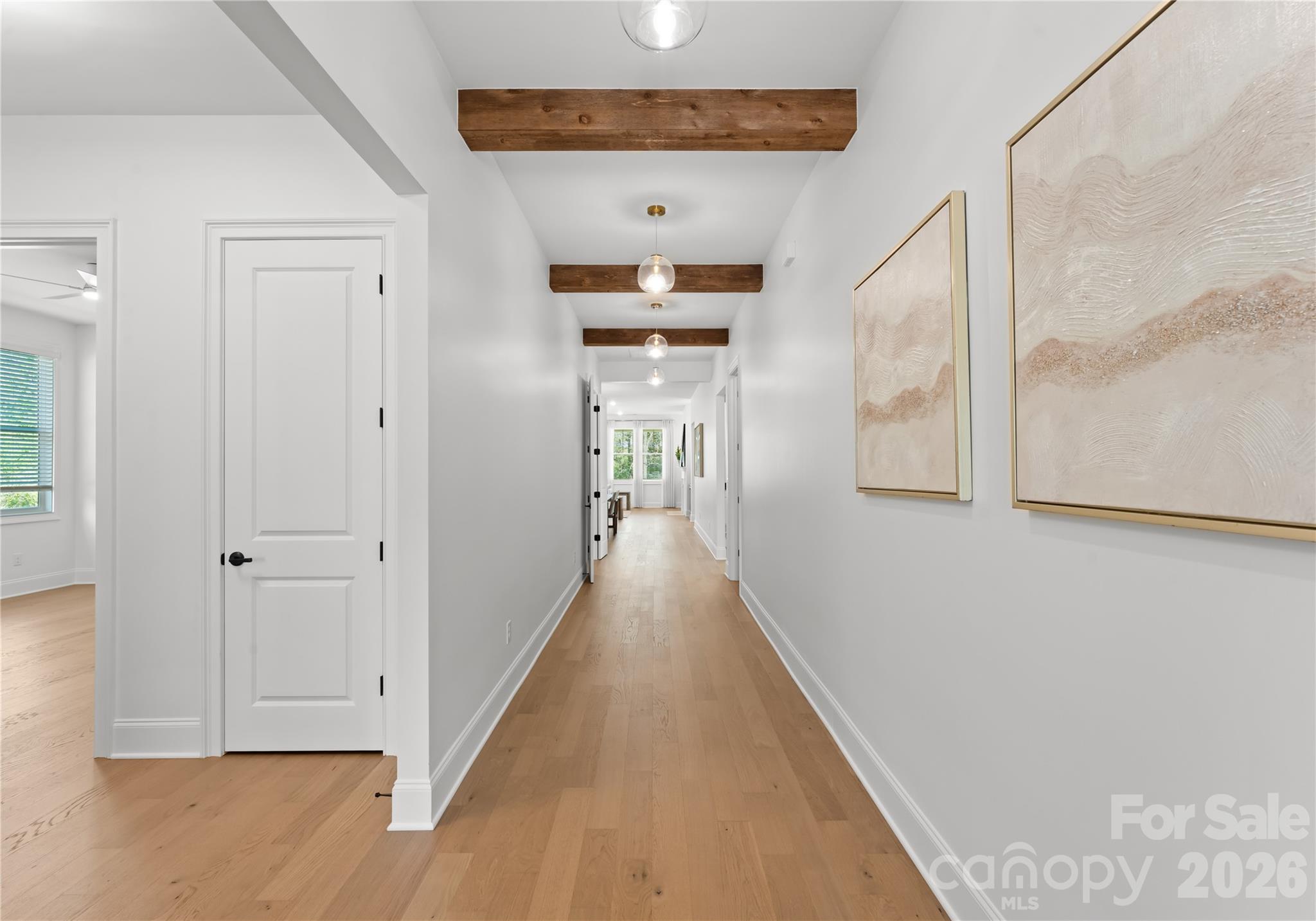 121 Vella Drive Locust, NC 28097 - Photo 6 of 46 a view of a hallway with wooden floor