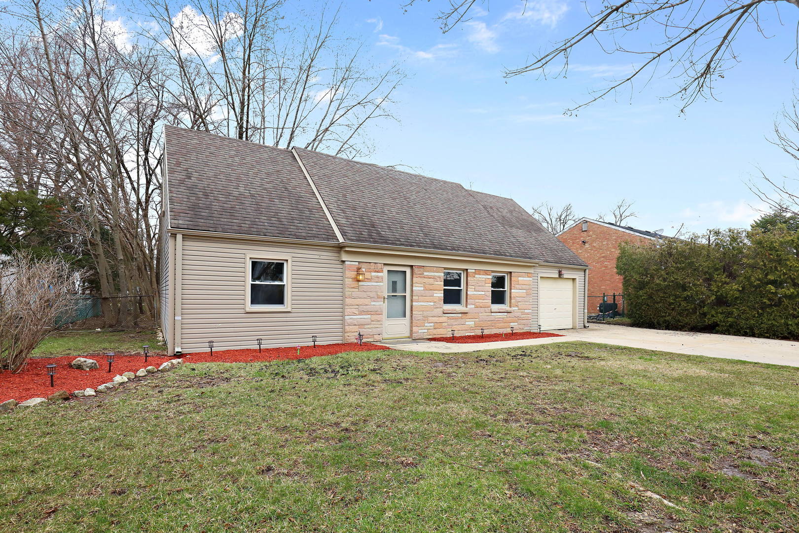 157 North Pinecrest Road Bolingbrook, IL 60440 - Photo 3 of 17 a front view of house with yard and trees