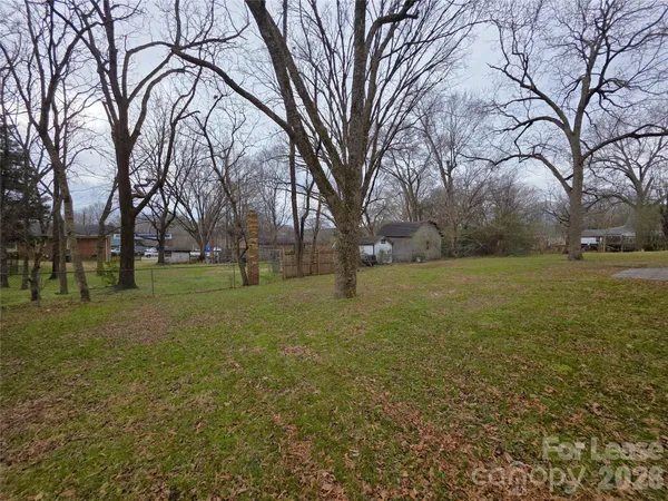 a view of a field with trees