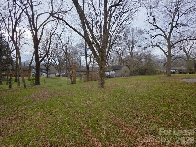 a view of a field with trees