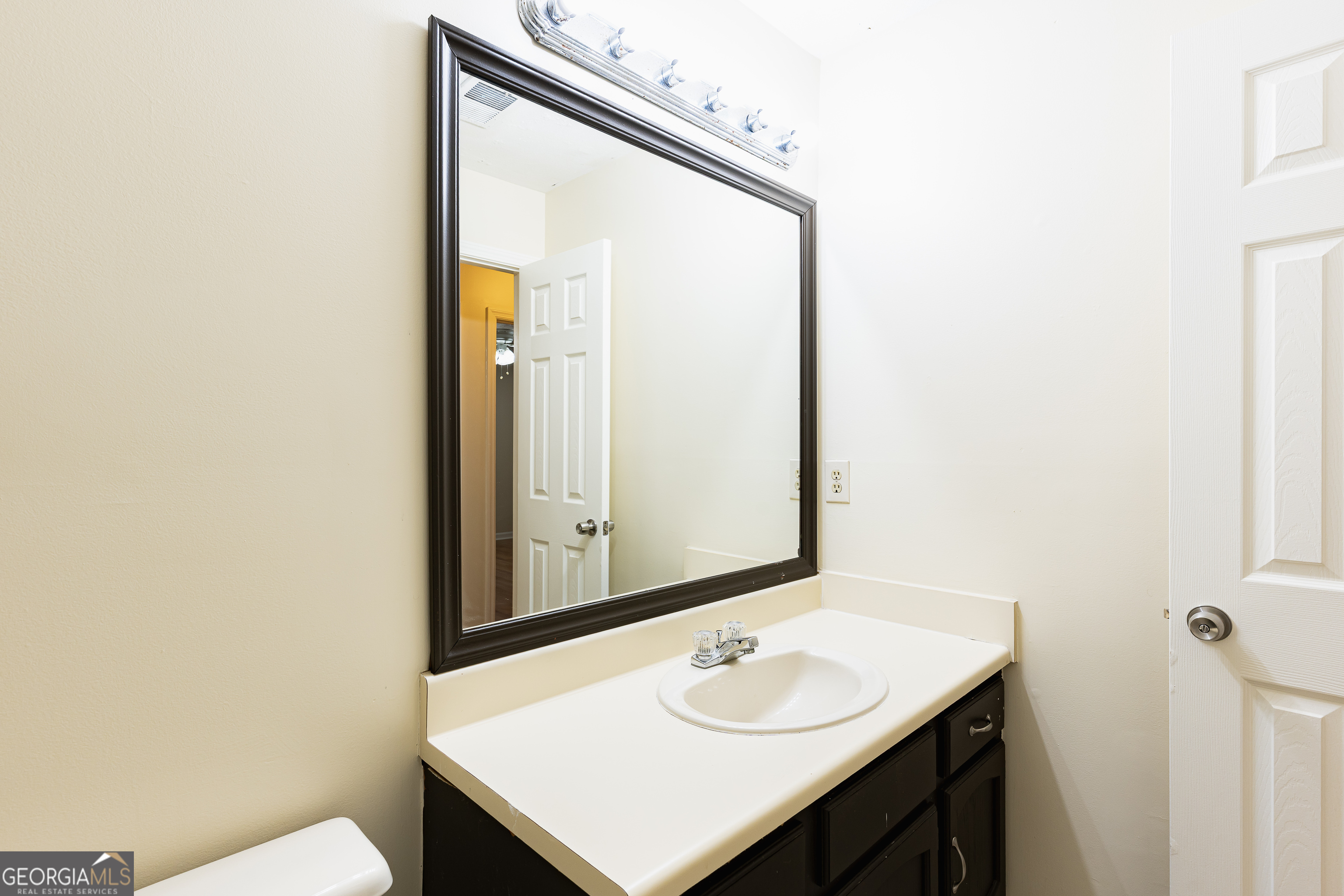 3821 Rex Mill Square Rex, GA 30273 - Photo 20 of 51 a bathroom with a sink and a mirror