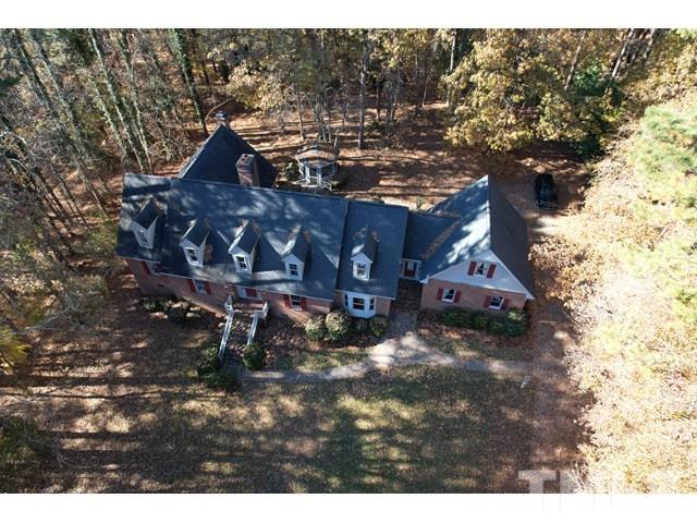 11705 Old Creedmoor Road Raleigh, NC 27613 - Photo 3 of 33 a view of a house with a yard
