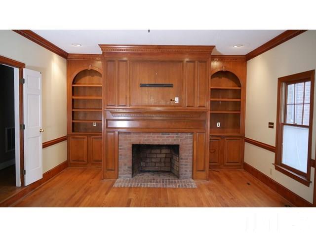 11705 Old Creedmoor Road Raleigh, NC 27613 - Photo 24 of 33 a open kitchen with furniture and a fireplace