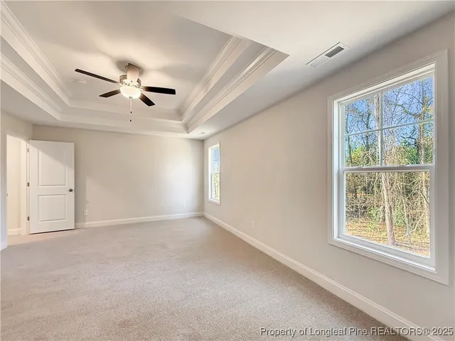 a view of empty room with windows