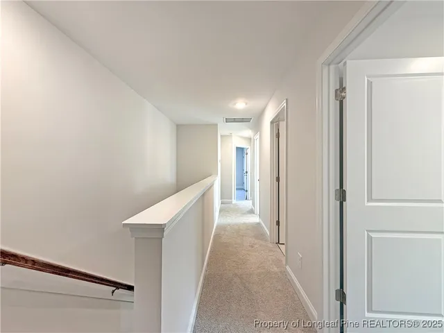 a view of hallway with stairs
