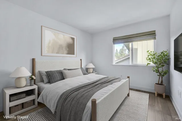 a bedroom with bed and window