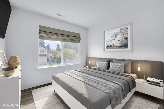 a bedroom with bed and window