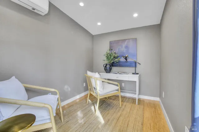 a workspace with furniture and wooden floor