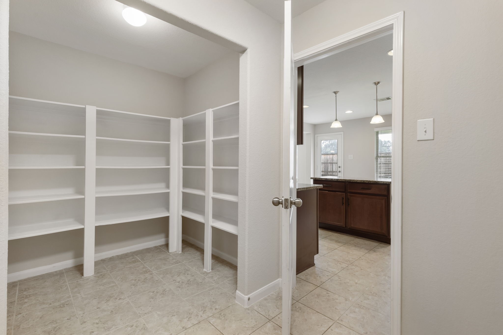 7130 Edwanna Lane Spring, TX 77389 - Photo 15 of 36 Huge pantry with ample shelving, ideal for storage just off of the kitchen!