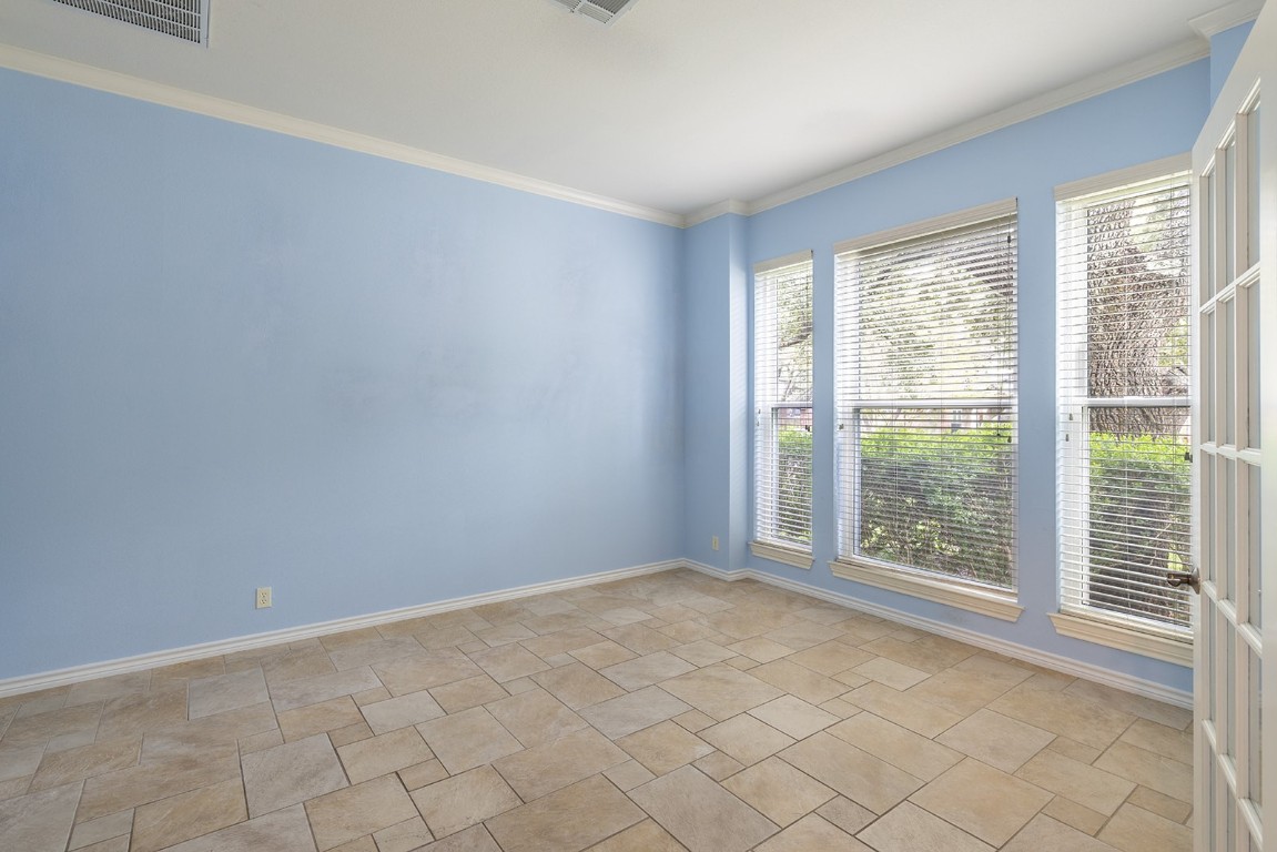 8514 Racine Trail Austin, TX 78717 - Photo 11 of 33 Unfurnished room with crown molding and baseboards