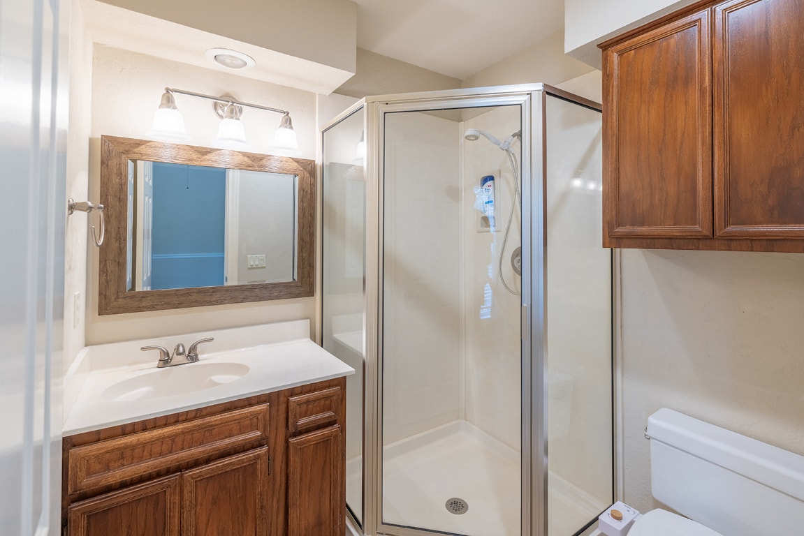 8514 Racine Trail Austin, TX 78717 - Photo 28 of 33 Bathroom featuring vanity and a shower stall