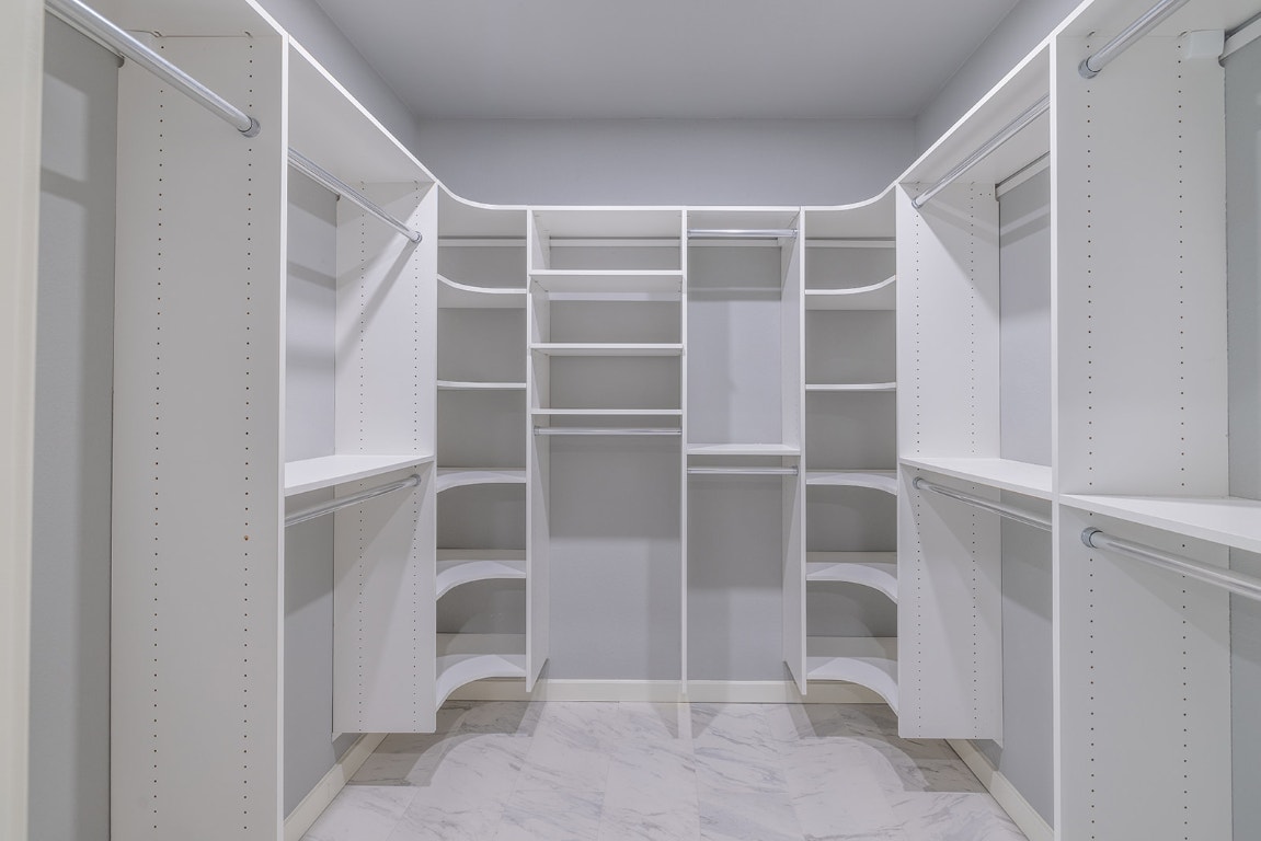 8514 Racine Trail Austin, TX 78717 - Photo 4 of 33 Walk in closet featuring light marble finish floors